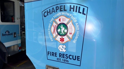 Chapel Hill Fire Rescue patch on a fire truck door