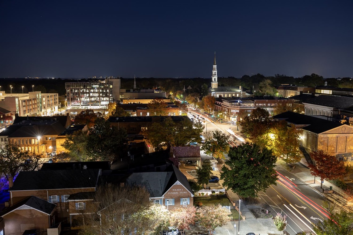 Nighttime skyline of downtown Chapel Hill buildings and streets
