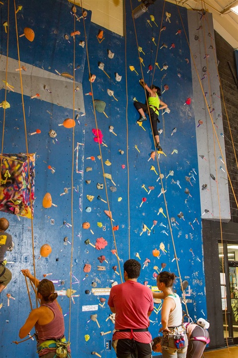 People climbing the climbing wall