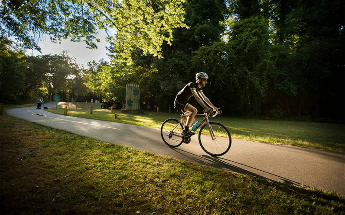Bicyclist riding on trail 