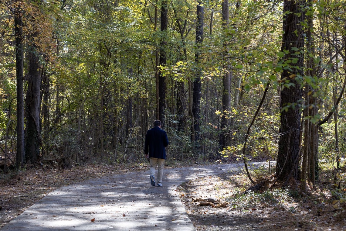 person walking on trail 